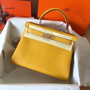 hermes colorado handbag in gold grained leather and beige canvas